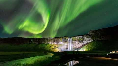 Northern lights over waterfall golden circle