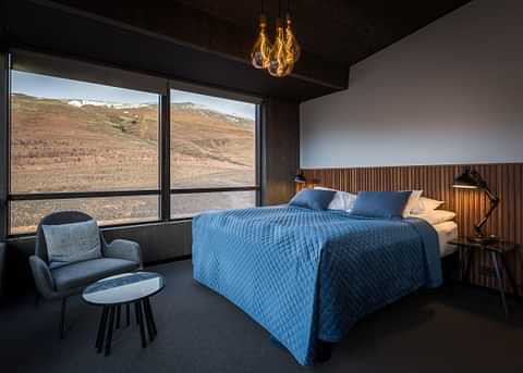 Fosshotel Glacier Lagoon bedroom with mountain view