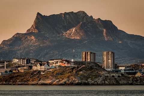 Buildings in Nuuk with the mountain Sermitsiaq in the background at sunset in Greenland 2048x1365