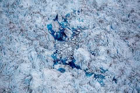 A blue meltwater lake on the Greenland ice sheet near Ilulissat in Greenland