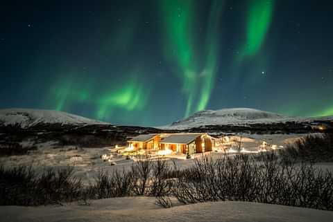 Aurora with wooden house